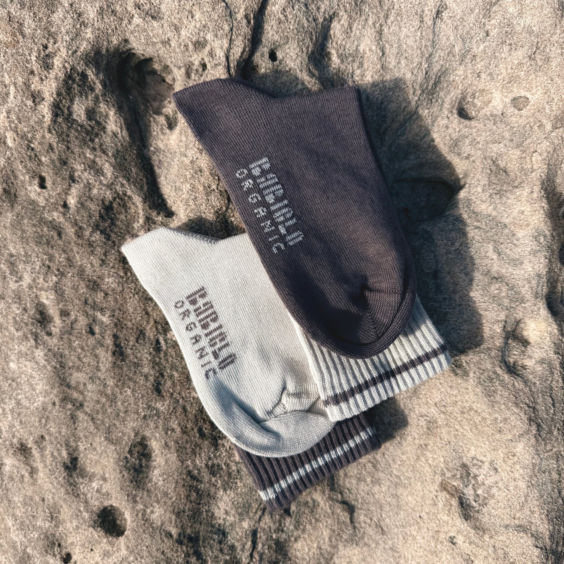 BABICLO premium organic cotton socks, showcasing a pair of sustainable socks on a textured surface.